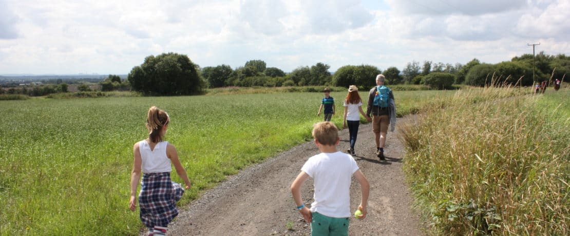 Family walking in Hulton Park