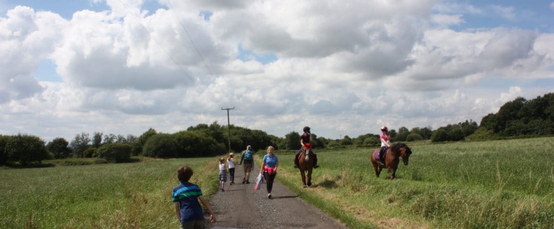 Pedestrians and horse riders on the right of way through Hulton Park