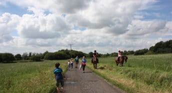 Pedestrians and horse riders on the right of way through Hulton Park