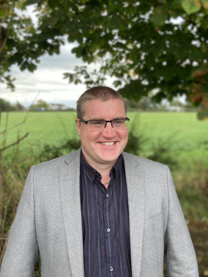 Matt Kennedy standing in countryside in Samlesbury, Lancashire